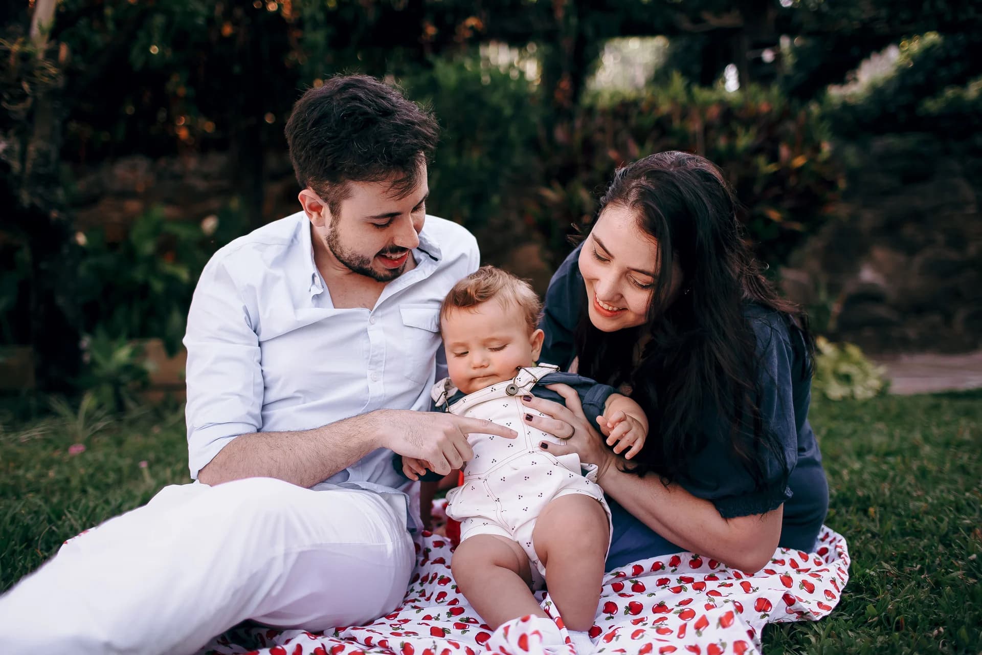 A family sharing a quiet moment together in the park