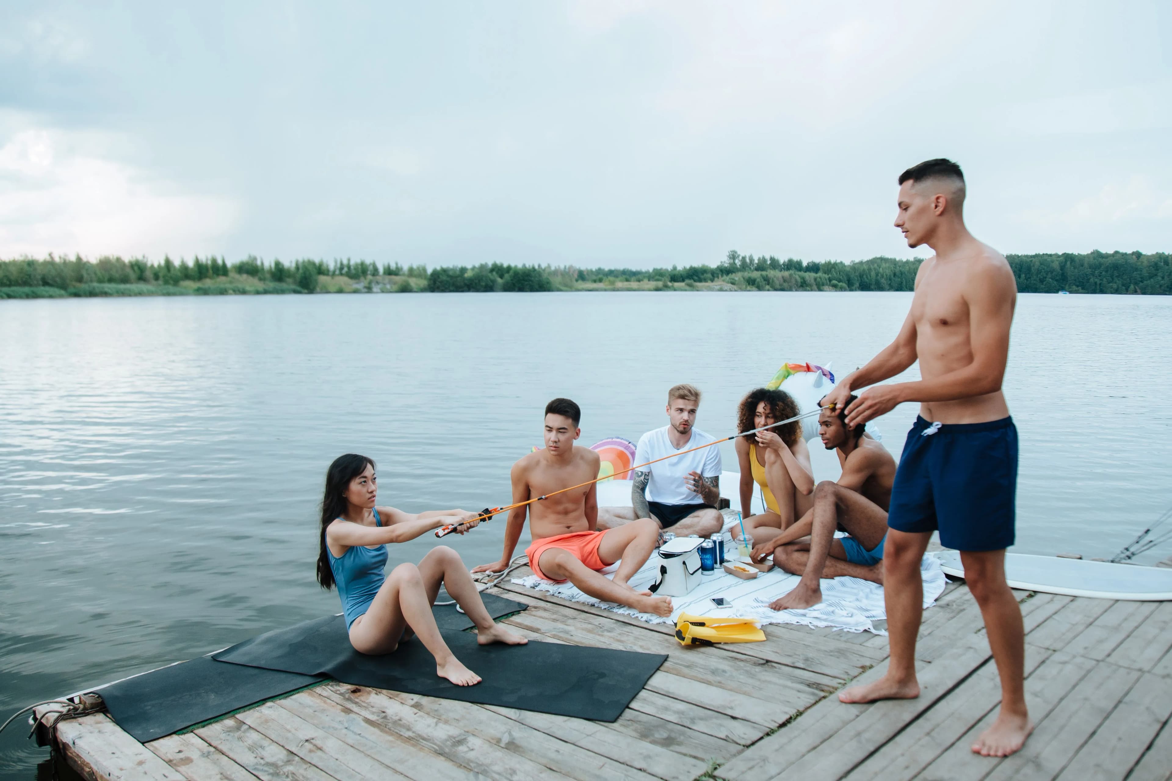 Friends spending time together beside a lake